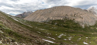 Views back to Divide Pass (L) from the east ascent slopes of Chirp Peak.