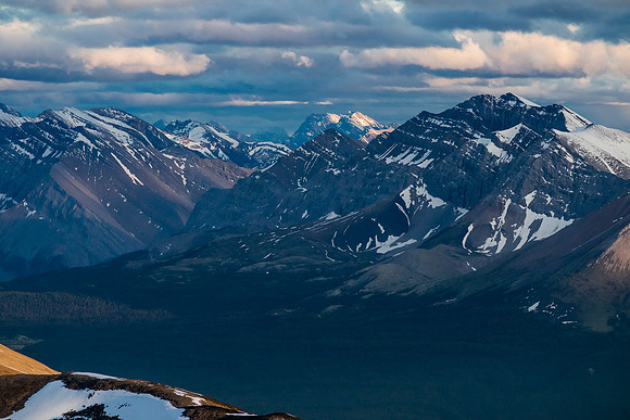Sira Peak catches late day lighting at distant center.