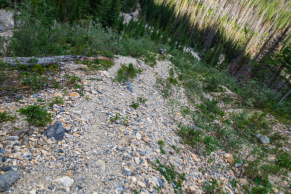 Descending the hard moraine-like rocky avy drainage.