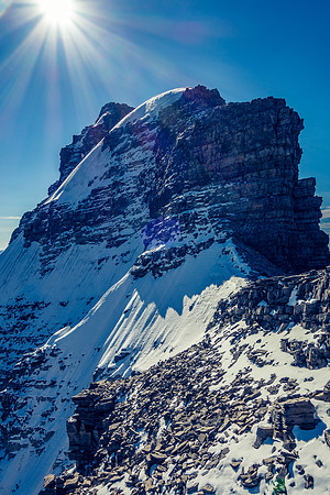 We contoured around the summit block on climber's right before ascending.