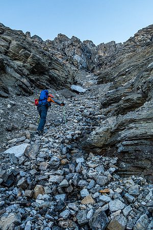 In the steep and very loose gully under the NW summit.