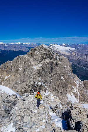 A view down off the summit as Raf approaches the highest point on Mount Murchison. We are clearly higher than the NW summit in the distance.