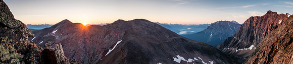 The sun rises over the ridge to the east. Whirlpool and Fryatt to the right.