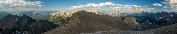 Phil at the upper col with incredible views back over the radio repeater.