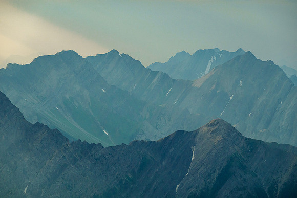 Shafts of evening sun through smoke.
