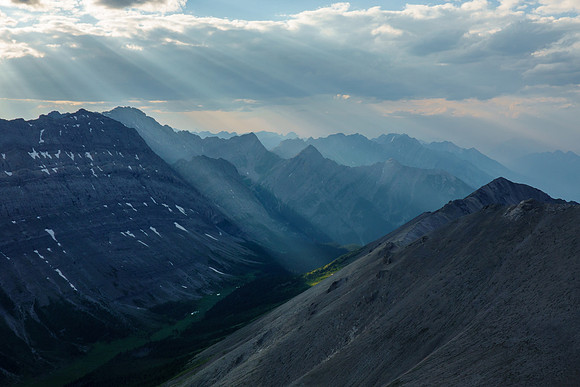 Shafts of evening sun through smoke.
