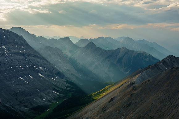 Shafts of evening sun through smoke.