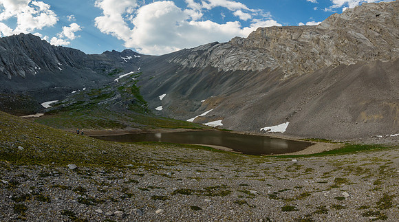Hiking alpine meadows to the upper Turbulent Lake.