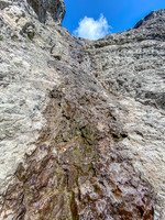 The upper crux is running water and very slick.