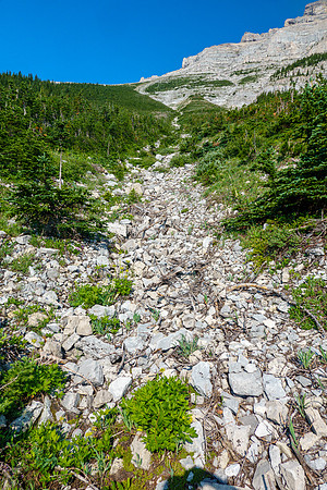 Ascending the east avalanche gully to the south end of the east face of Gould Dome.