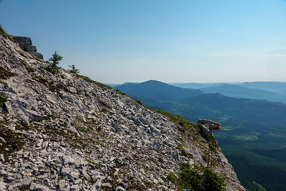Starting up the west face - an obvious natural cairn at right.