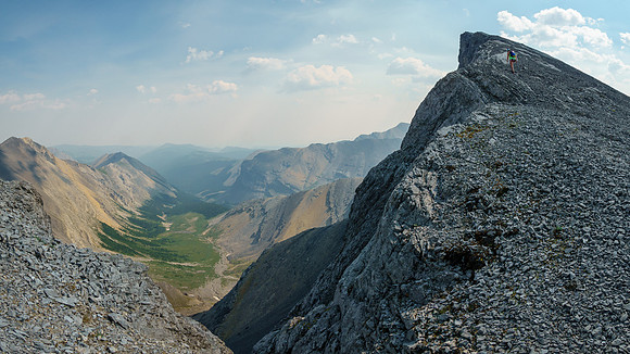 Scrambling along the east sidewalk abutment ridge.
