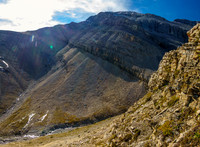 Views down the problematic cliff band. Zombie Peak above.
