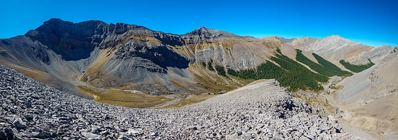 "Chupacabra" Peak is impressive over a lovely alpine meadow.