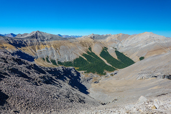 My descent ridge at left descending to the valley below, Otuskwan at distant right.