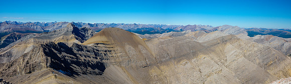 Descending to the col with the scree traverse to the "Grimes" and "Grimes Jr" visible.