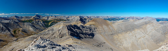 Descending to the col with the scree traverse to the "Grimes" and "Grimes Jr" visible.