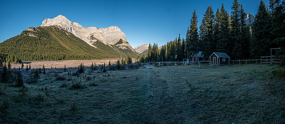 Outliers of Mount Cautley over the Bryant Creek warden cabin. Mount Mercer at upper right.
