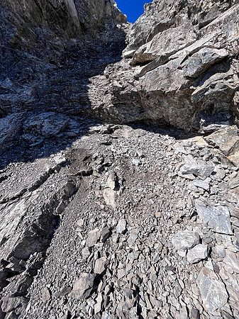 Downclimbing off the south end of the south ridge.