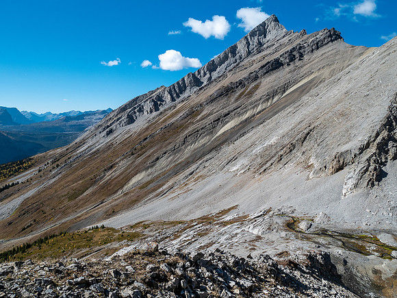 Traversing rubble and scree slopes west towards False Allenby.