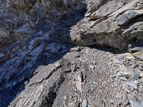 Downclimbing off the south end of the south ridge.