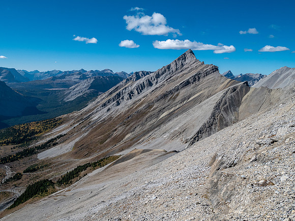 Traversing rubble and scree slopes west towards False Allenby.