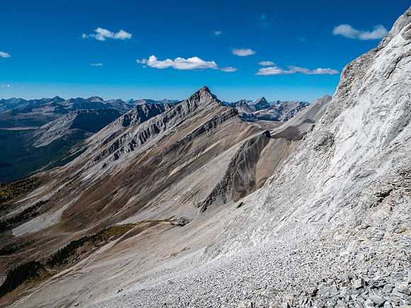 Traversing rubble and scree slopes west towards False Allenby.