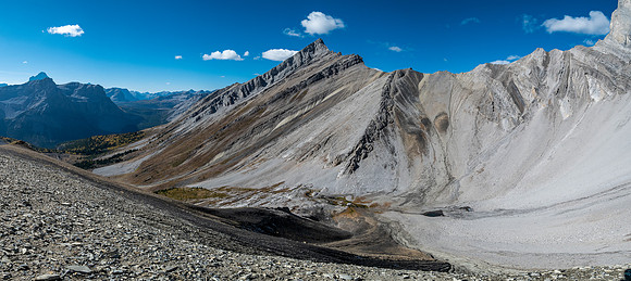 Traversing rubble and scree slopes west towards False Allenby.