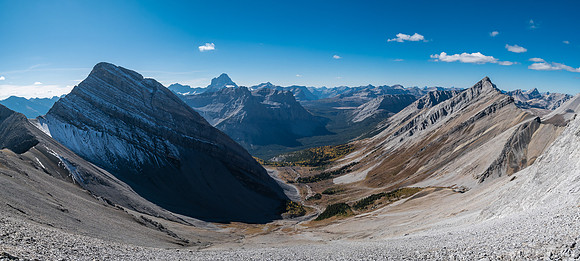 Traversing rubble and scree slopes west towards False Allenby (R).