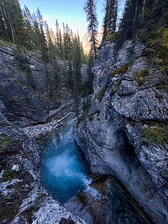 A scenic waterfall near the Flints Park campground with the North Cascade River flowing towards the Cascade River.