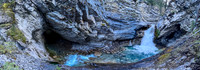 A scenic waterfall near the Flints Park campground with the North Cascade River flowing towards the Cascade River.