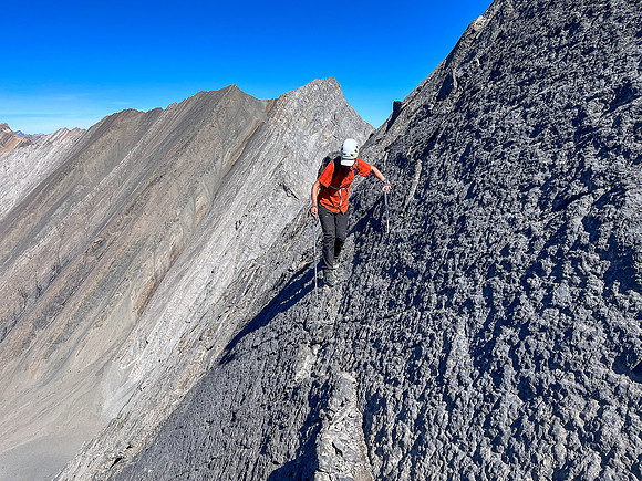 Descending the steep upper west face of Cuthead Peak.