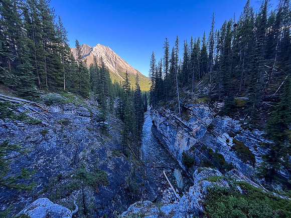 A scenic waterfall near the Flints Park campground with the North Cascade River flowing towards the Cascade River.