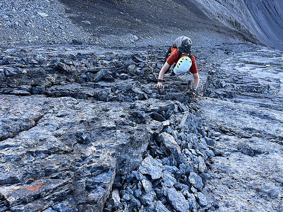 Ascending the steep upper west face of Cuthead Peak.