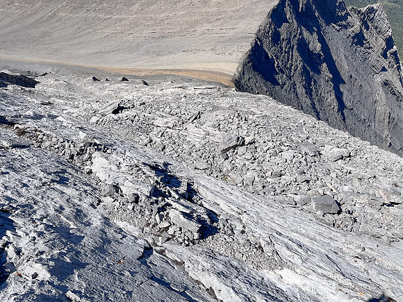 Descending the steep upper west face of Cuthead Peak.