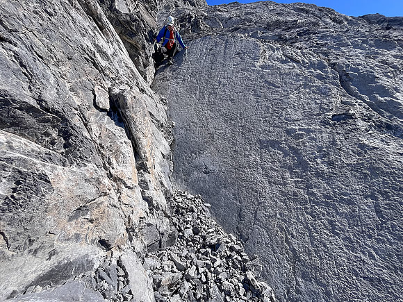 Descending the steep upper west face of Cuthead Peak.