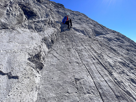 Descending the steep upper west face of Cuthead Peak.