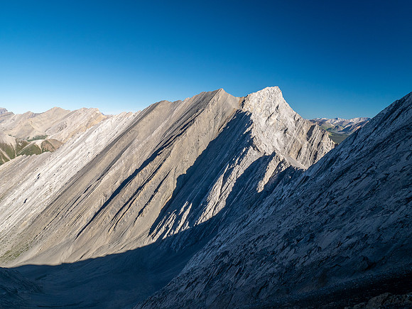 Ascending the steep upper west face of Cuthead Peak.