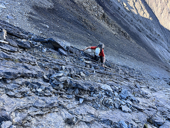 Ascending the steep upper west face of Cuthead Peak.