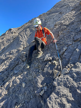 Descending the steep upper west face of Cuthead Peak.