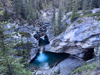 A scenic waterfall near the Flints Park campground with the North Cascade River flowing towards the Cascade River.