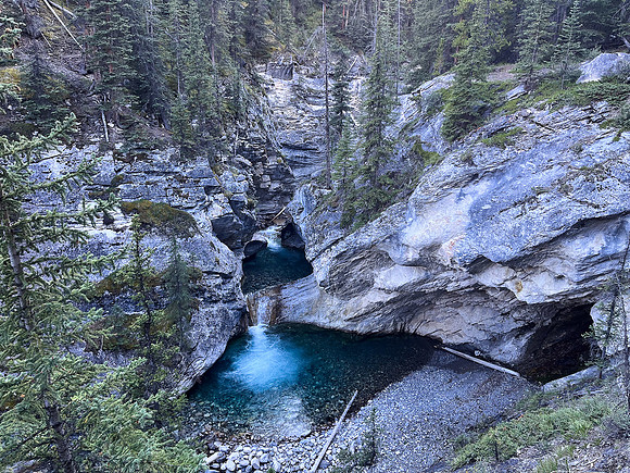 A scenic waterfall near the Flints Park campground with the North Cascade River flowing towards the Cascade River.