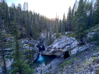 A scenic waterfall near the Flints Park campground with the North Cascade River flowing towards the Cascade River.