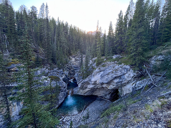 A scenic waterfall near the Flints Park campground with the North Cascade River flowing towards the Cascade River.