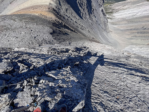 Descending the steep upper west face of Cuthead Peak.