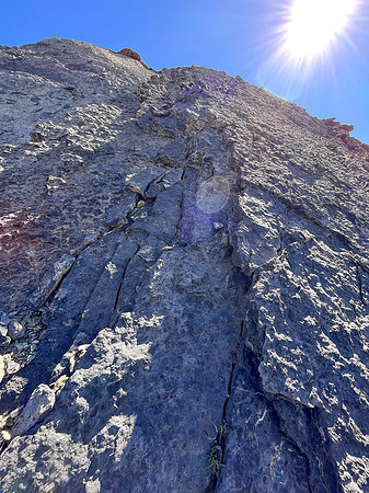 Descending the steep upper west face of Cuthead Peak.