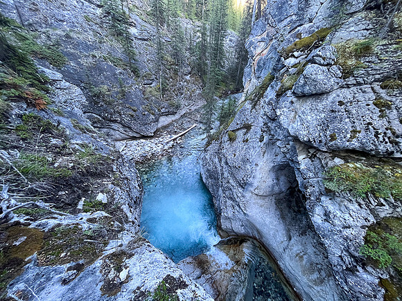 A scenic waterfall near the Flints Park campground with the North Cascade River flowing towards the Cascade River.