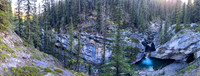 A scenic waterfall near the Flints Park campground with the North Cascade River flowing towards the Cascade River.