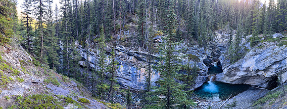 A scenic waterfall near the Flints Park campground with the North Cascade River flowing towards the Cascade River.