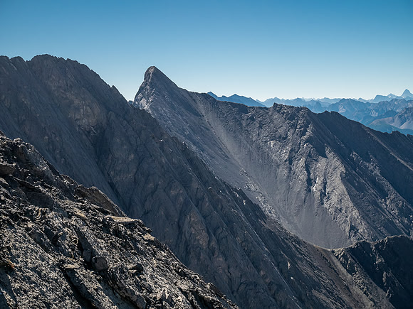 Descending the steep upper west face of Cuthead Peak.